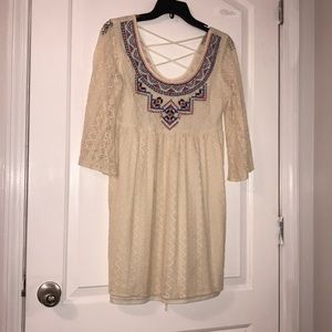 A beautiful ivory dress with cute designs at front